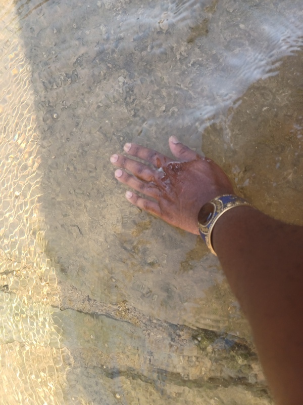 Jon Lee Hand in Baptism Site Water